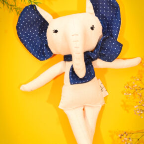Handmade fabric elephant doll with navy polka dot ears and bow